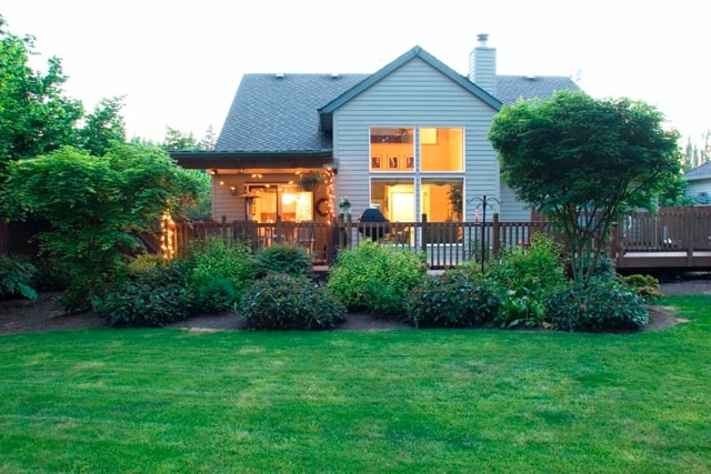Charming residential home at twilight with illuminated windows